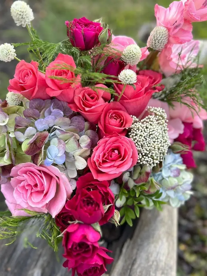 Pink and blue seasonal arrangement by Vintage Blooms KC